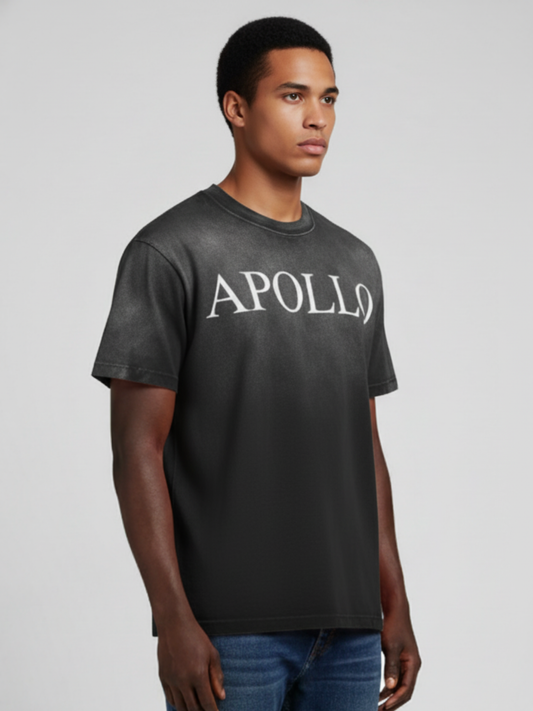 Man wearing a black t-shirt with 'APOLLO' text on a gray background