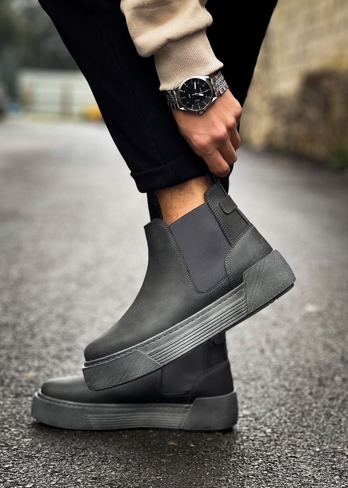 Close-up of Avalon Noir Essence charcoal Chelsea boots with matte gray sole.